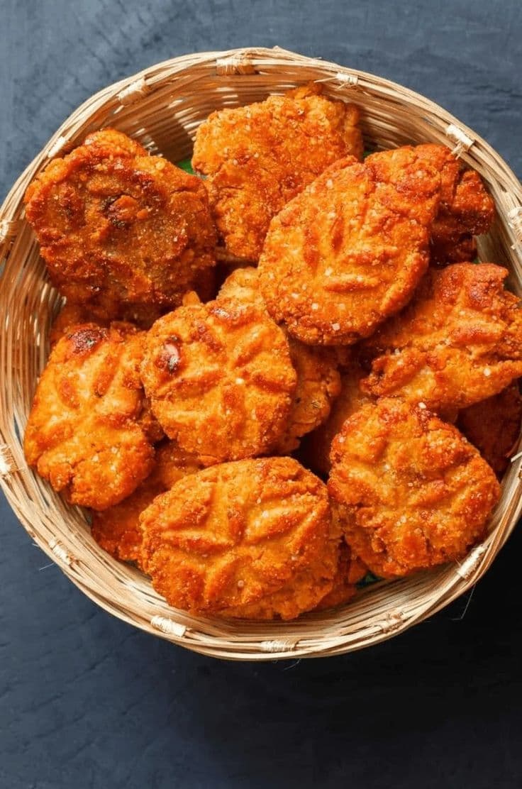 Homemade Bihari thekua in a bamboo basket, made by her